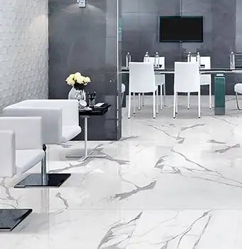 Statuario marble slab with bold grey veining on white surface