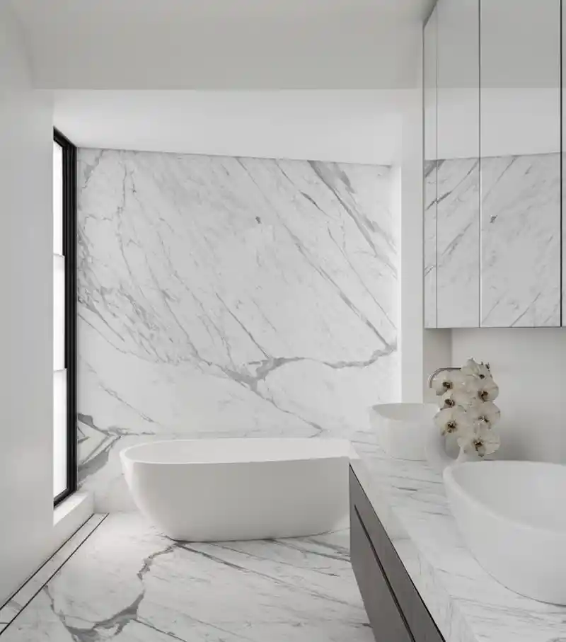 Statuario marble slab with bold grey veining on white surface